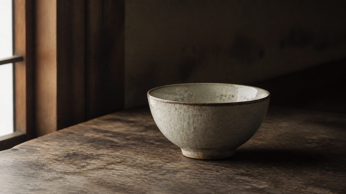 Handmade Japanese ceramic rice bowl on a wooden table
