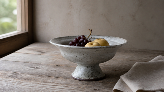 Shigaraki ash-glazed pedestal bowl in a quiet home table setting