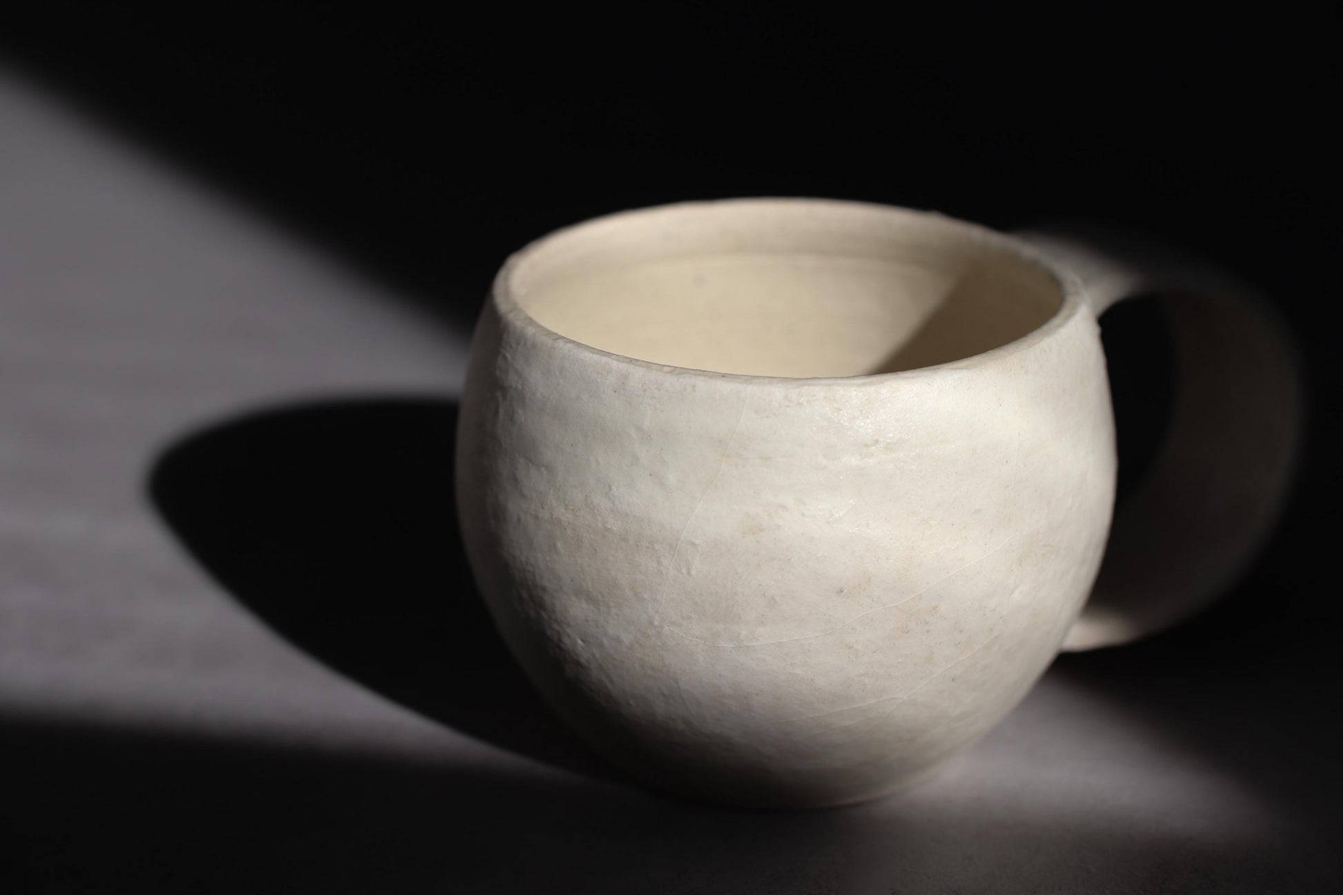 Handcrafted Minimalist White Ceramic Mug by Yukiko Oonakahara | Japanese Pottery | Wabi-sabi Cup
