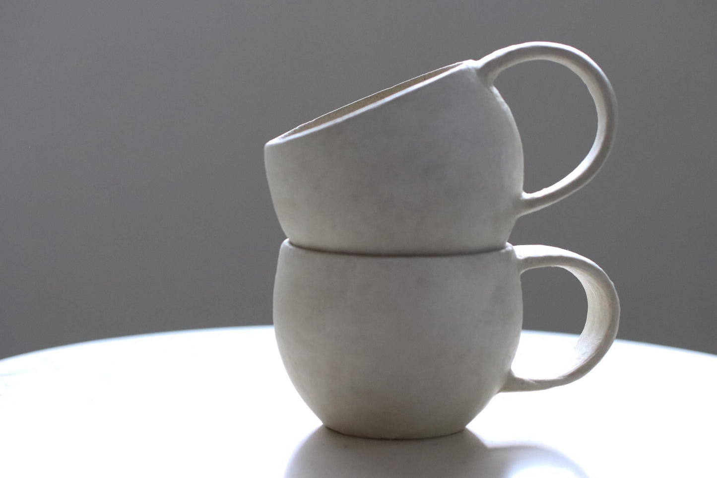 Handcrafted Minimalist White Ceramic Mug by Yukiko Oonakahara | Japanese Pottery | Wabi-sabi Cup