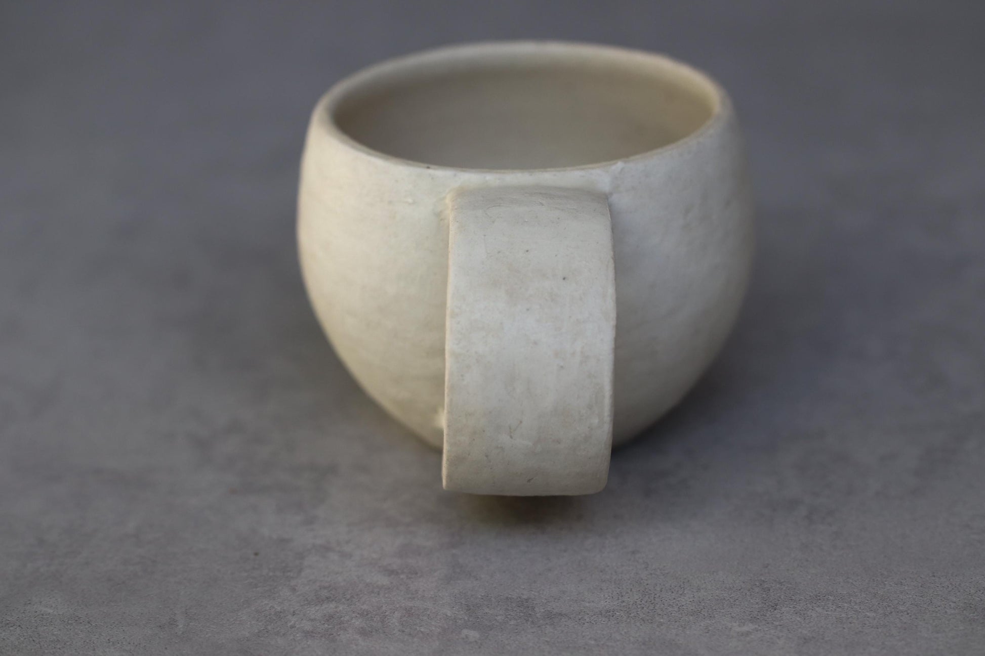 Handcrafted Minimalist White Ceramic Mug by Yukiko Oonakahara | Japanese Pottery | Wabi-sabi Cup