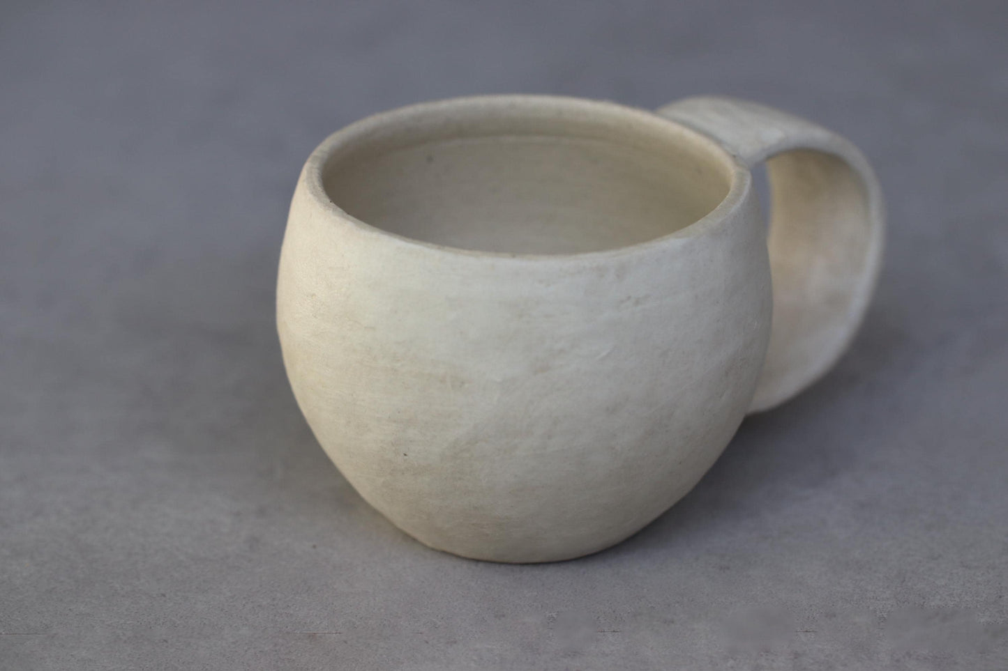 Handcrafted Minimalist White Ceramic Mug by Yukiko Oonakahara | Japanese Pottery | Wabi-sabi Cup