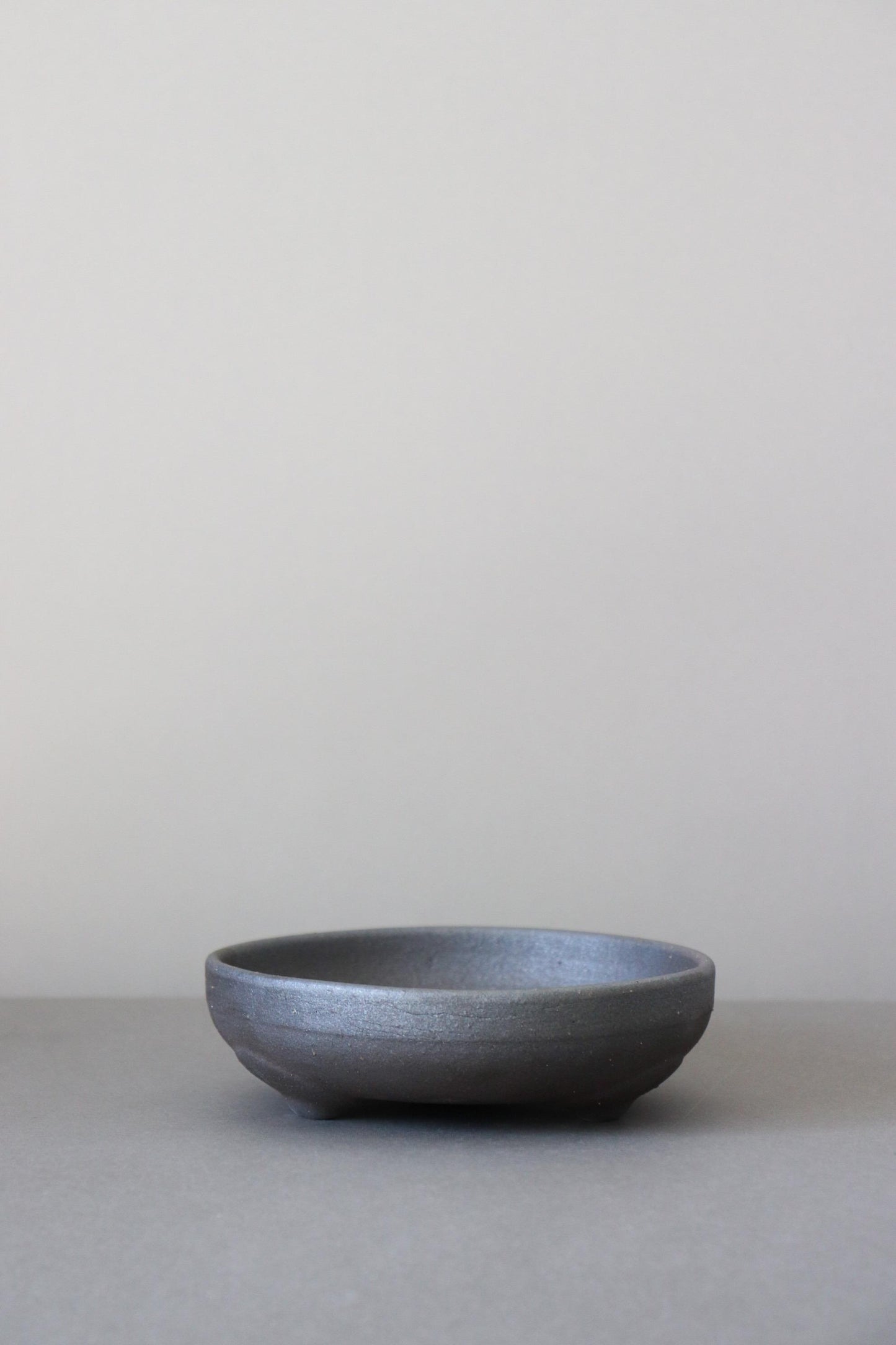 Japanese Black Footed Bowl | Charcoal Stoneware Serving Bowl | Made in Japan Ceramic Dish | Wabi Sabi Tableware | Small Raised Bowl